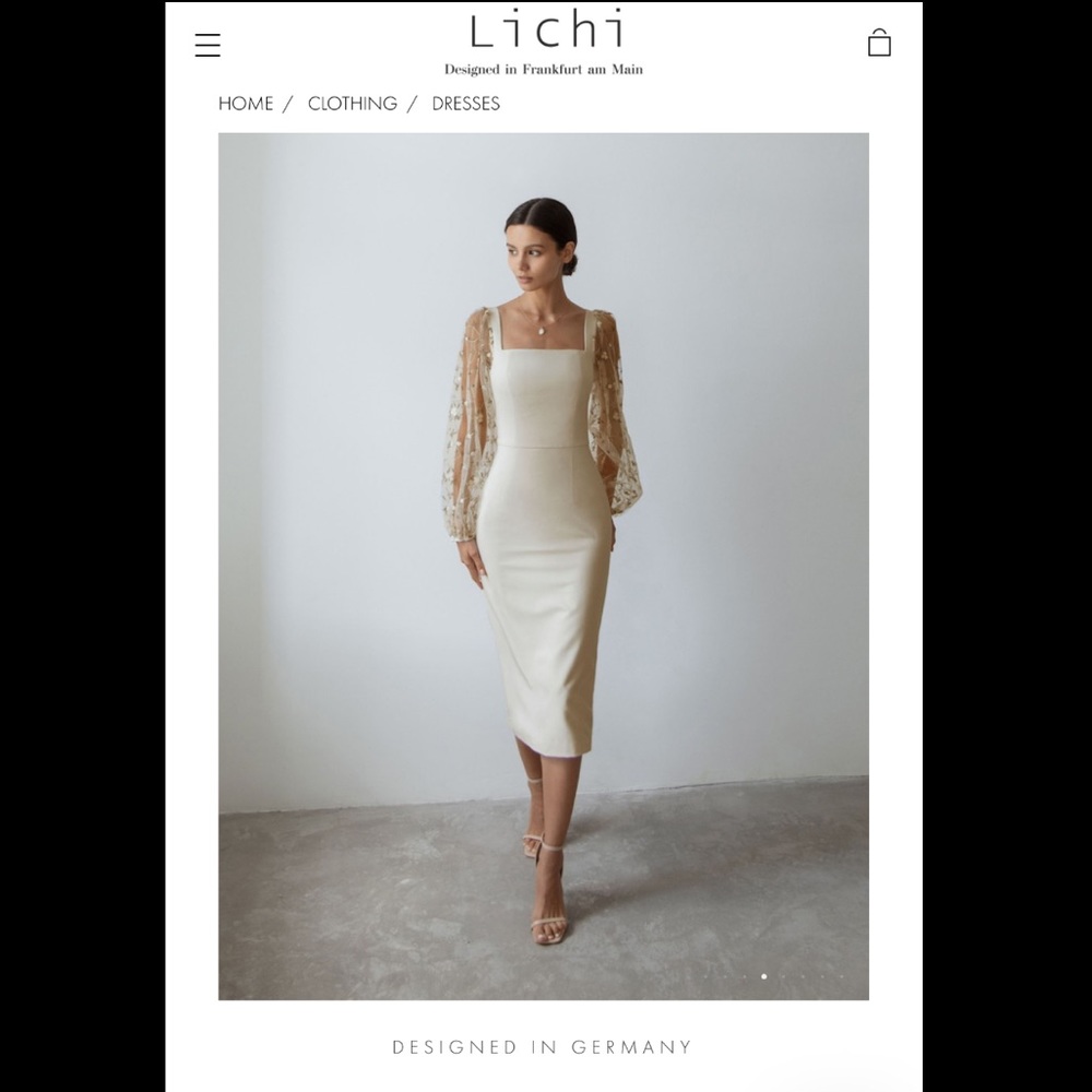 Tulle-sleeve midi dress. Designed in Germany. Size: XS-S.